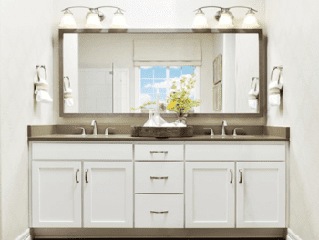 Double vanity with white cabinets.