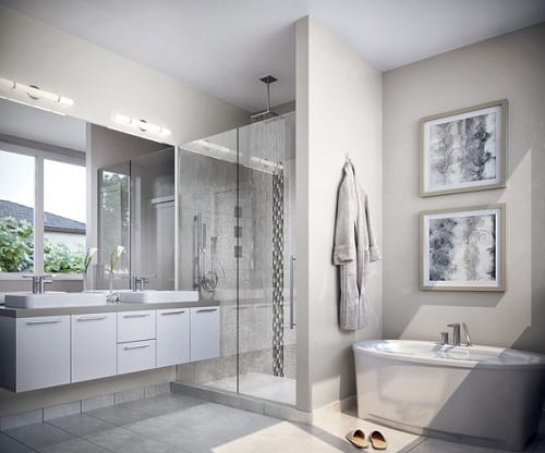 Modern master bath featuring wall mounted vanity and freestanding tub.