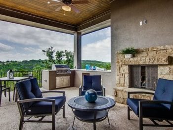 Outdoor patio with stone fireplace