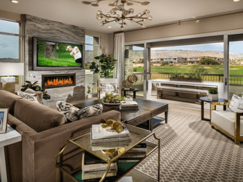 Living room with a view of outdoor patio overlooking golf course.