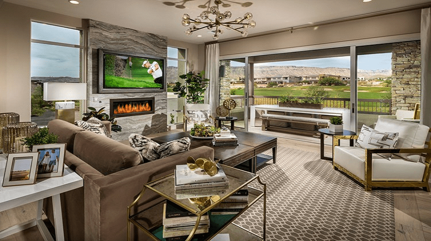 Living room with a view of outdoor patio overlooking golf course.