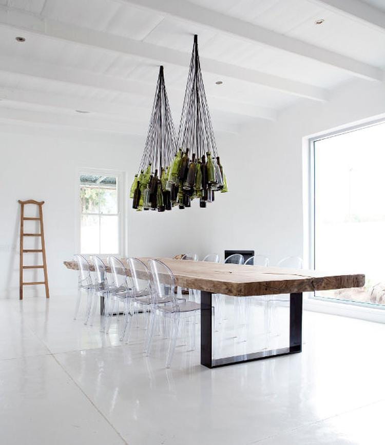 Wine bottle chandelier over industrial table