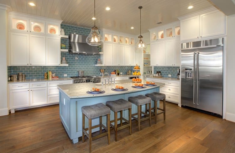 Drees Homes - Kitchen with blue subway tile with white cabinets and blue island.