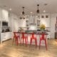 White kitchen with red stools.