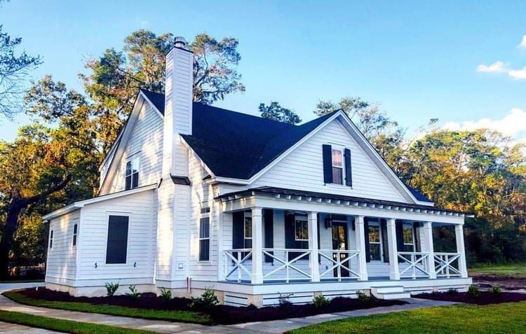 White cottage-style with front porch.