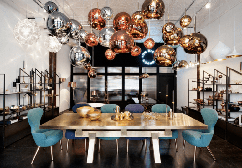 Dining table with bronze ball pendant shape light fixtures