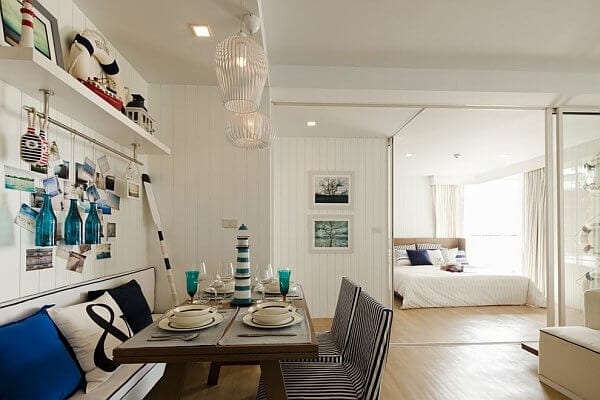 Nautical dining room with view of bedroom.