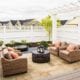 Stone patio with outdoor seating with fountain.