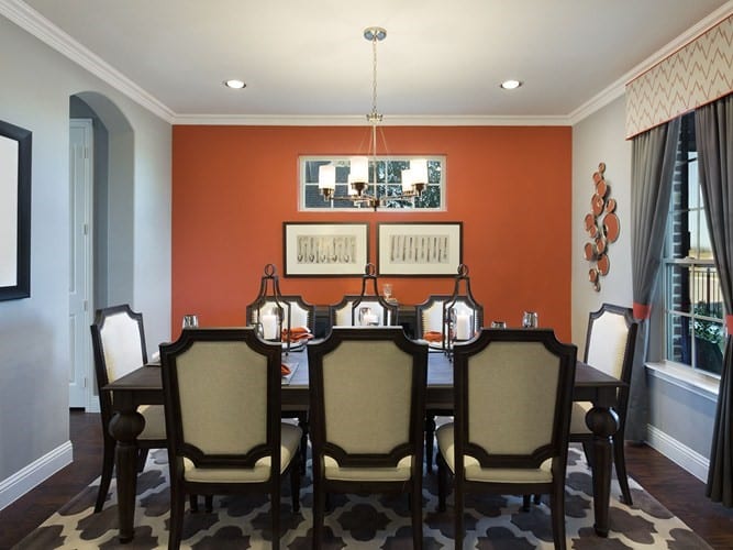 Dining table with burnt orange feature wall