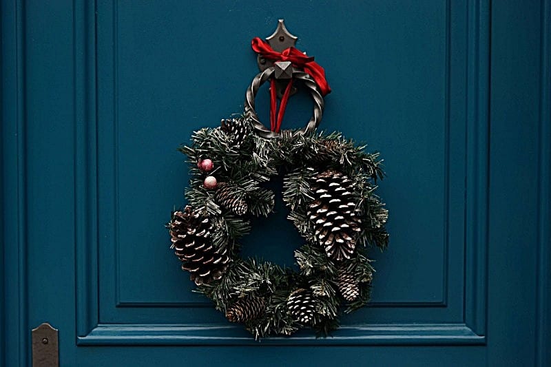 Christmas wreath on blue door.